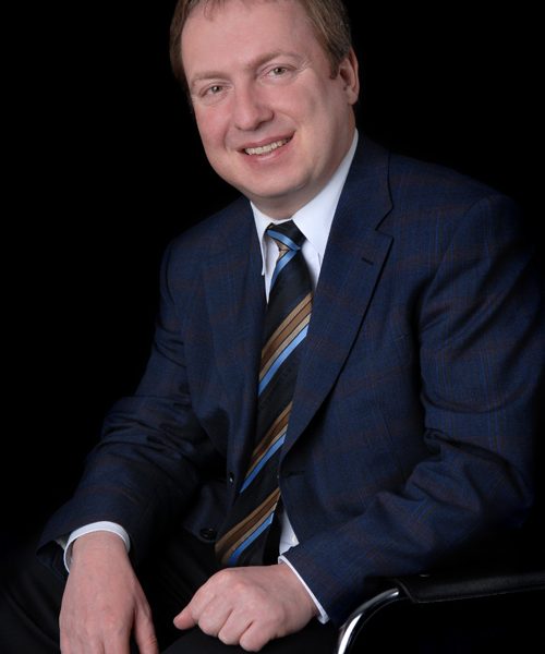 Businessfotos im Fotostudio München: Mann sitzend